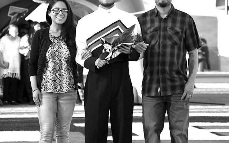SENIOR BAND - Levelland seniors were recognized last Friday during the Lobo football home game against the Borger Bulldogs. Senior Michael Osornio was escorted by his parents Vicki and Oscar Osornio. (Staff Photo by Dom Puente)