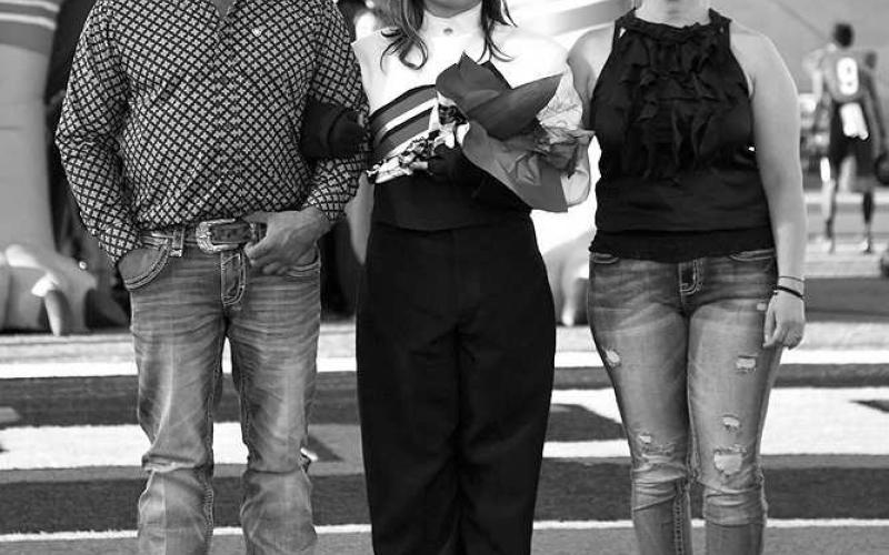 SENIOR BAND - Levelland seniors were recognized last Friday during the Lobo football home game against the Borger Bulldogs. Senior Annelise Delgado was escorted by her parents Raul Delgado and Maribel Gomez. (Staff Photo by Dom Puente)