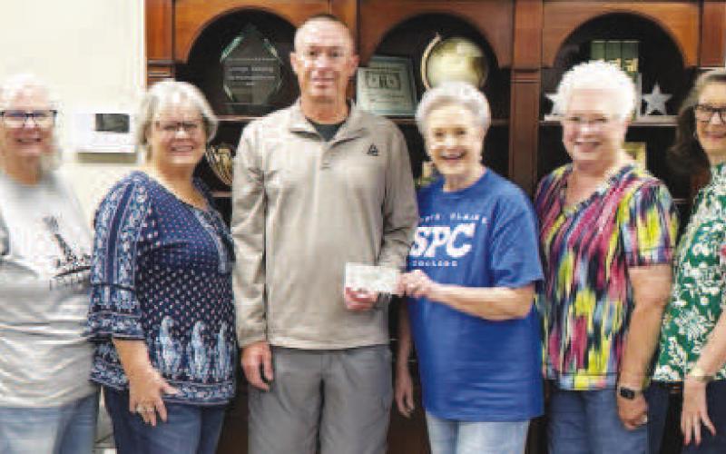 SUNDOWN YOUTH SOFTBALL LEAGUE DONATION - Xi Theta Pi Chapter of Beta Sigma Phi recently donated funds to the Sundown Youth Softball League. Pictured (center) is Jeremy Ladd accepting the check on behalf of the organization. Sorority members attending the presentation are Donna Wheeler, Terry Reynolds, Linda Darnell, Judy Gray and Iris Keeling. (Photo courtesy of Xi Theta Pi Chapter of Beta Sigma Phi)