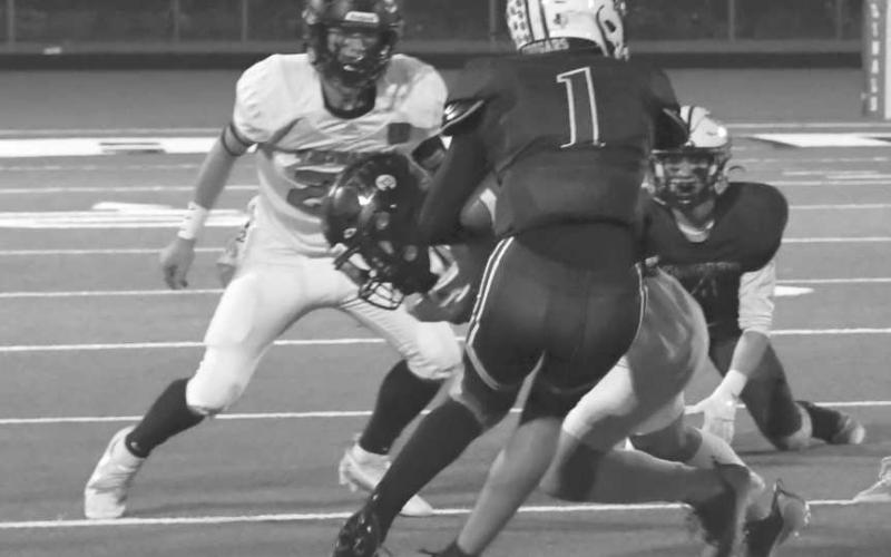 TEAMWORK - Rayden Potter and Brolin Kennedy combined to bring down a Klondike runner in a 64-16 Whitharral Panther loss in the area round of the UIL High School 1A-2 Football Playoffs last Friday in Hermleigh. The Panthers finish their season 9-2. (Staff photo by Jay Kelley)