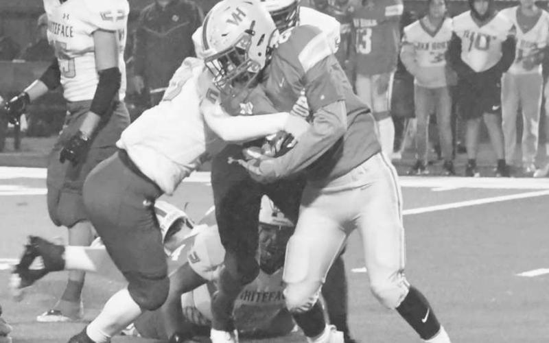STAY DOWN - Defense is a hallmark of the Whiteface Antelope football philosophy. Jaxon Heflin and Auscar Gandara took a Van Horn runner down last Thursday in UIL Class 1A-1 high school bi-district action on their way to 58-8 win in Rankin. The Antelopes will face Borden County Friday at 7 p.m. in Slaton. (Staff photo by Jay Kelley)