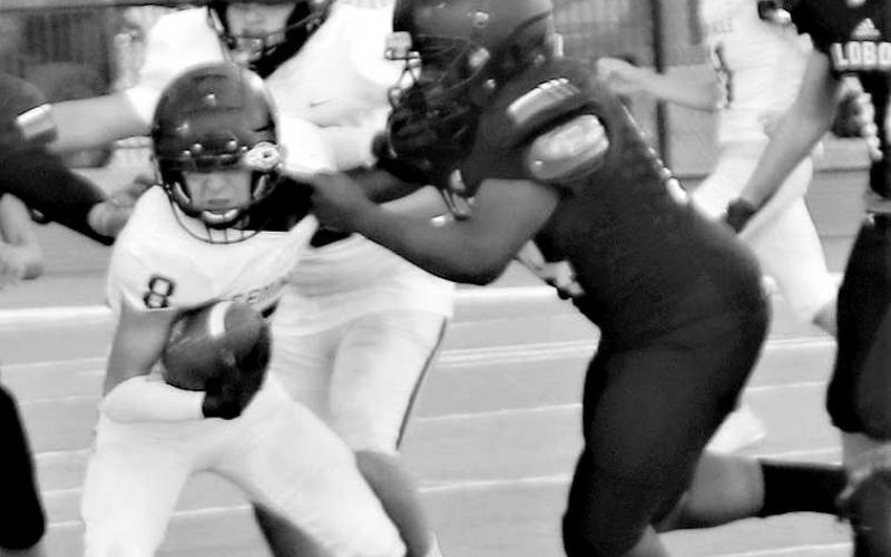 MAKING A PLAY- Levelland Lobo freshman Tanane Brackens pulled down a Seminole ball carrier last Thursday. The Levelland freshman team concluded their season with a loss at home to the Indians. (Staff Photo by Shawn Franklin)