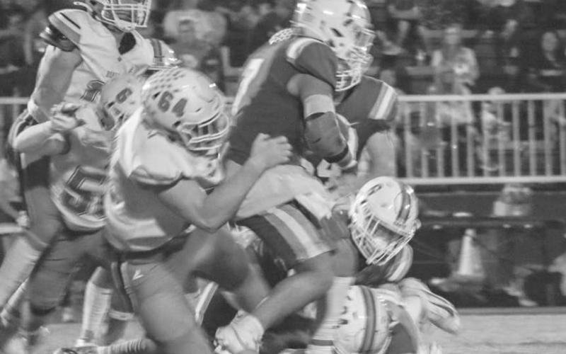 NOT SO FAST - Ropes Eagle Reid McCaleb dragged down the Tahoka runningback during the team’s district opener on the road. (Staff photo by Aalijah Soliz)