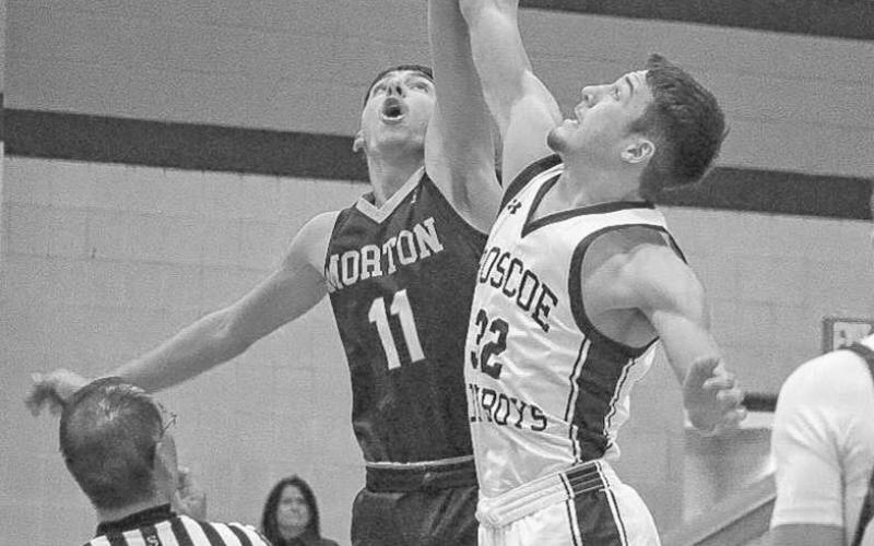 TIP OFF - Morton Indian A.J. Mendoza jumped for the ball at the start of the game to get his team the first possession of the game in Lamesa last Thursday night. (Staff photo by Aalijah Soliz)