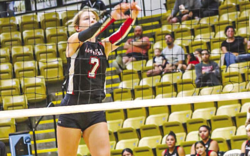 FAKE OUT - Levelland Loboette Addisen Campbell faked the set up to her teammates and hit the ball over the net to get the Loboettes a point in their contest this past Tuesday in Andrews. (Staff photo by Aalijah Soliz)