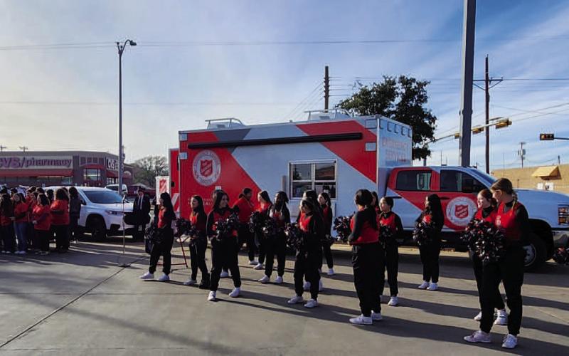 LISD KICKS OFF SEASON OF GIVING - As the Hockley County Salvation Army unit hosted their annual Red Kettle Kick-Off Tuesday. Levelland ISD showed their support with the LHS Choir, Drum Line and Cheer Team were in attendance. The LHS Choir sang Christmas songs while the LHS Cheer Team performed several cheers. The LHS Drum Line also performed during the event. Community members in attendance were given small Salvation Army bells to spread awareness and community cheer. (Staff photo by Dom Puente)