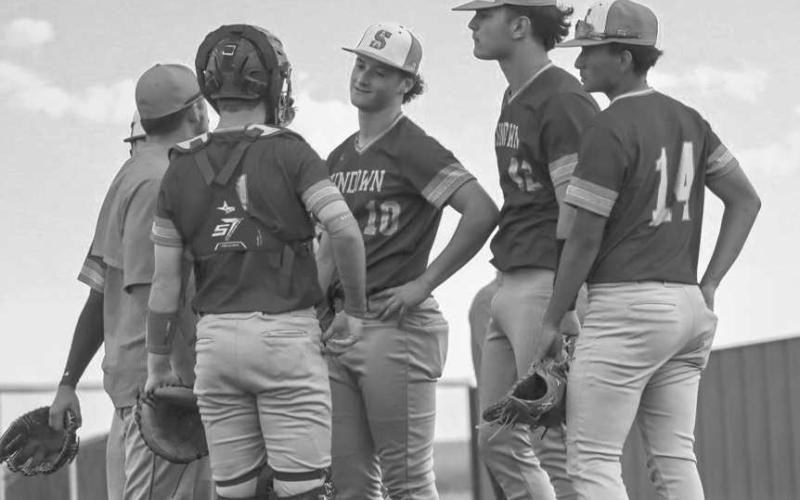 GAMEPLAN - The Sundown Roughnecks gathered around the mound during the team’s game against the New Home Leopards this past Tuesday as the visiting team. (Staff photo by Aalijah Soliz)