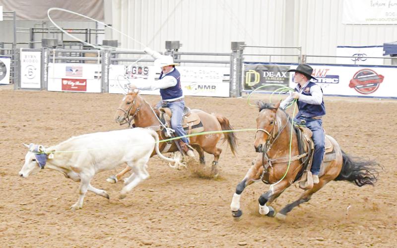 TEAM ROPING CHAMPS - SPC’s Levi Sasser and Jaxon Stoker compete in the team roping during the SPC Rodeo at the Mallet Event Center &amp;amp; Arena this past Saturday. The duo would place first in the event. (Staff photo by Jentezen Smith)