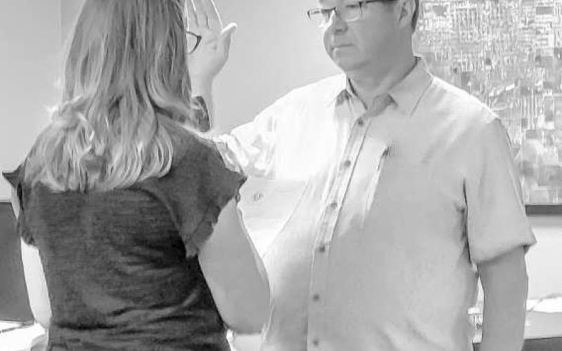 COUNCIL MEMBER DISTRICT D - Levelland City Councilman Michael Stueart underwent an Oath of Office which was administered by the City Secretary Andrea Corley during Monday evening's regular council meeting. Stueart ran in the May general election as an incumbent. (Staff photo by Dom Puente)