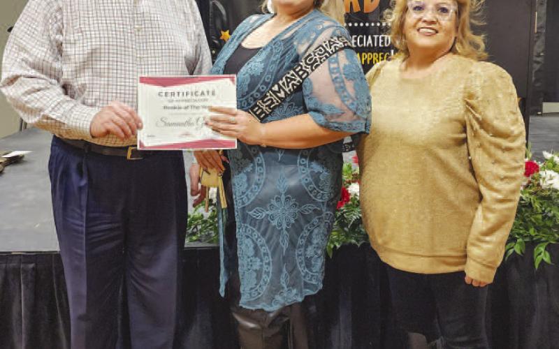 ROOKIE OFTHEYEARAWARD - The City of Levelland held its 55th annual Employee Appreciation Banquet Thursday at the Mallet Event Center and Arena. During the awards portion of the event, Diana Romo presented the Rookie of the Year Award which was presented to Sam Gomez. The Rookie of the Year Award is a new addition to the banquet’s award selection and will be continued moving forward. Pictured is City Manager James Fisher alongside Gomez and Romo. (Staff photo by Dom Puente)