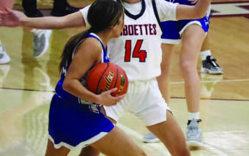 LOCKDOWN - Loboette Kaylee Penner played great defense to stonewall the Olton Philly in her tracks during the teams first win of the Littlefield Tournament. (Staff photo by Aalijah Soliz)