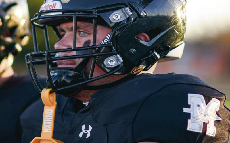 TEAM CAPTAIN - Senior lineman and Morton football team captain Britton Boggs watches the pregame coin toss before their game against Ralls this past Friday night at Indian Stadium. (Staff photo by Jentezen Smith)