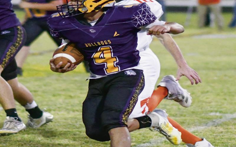ALAFA ON THE LOOSE - Freshman running back Isaiah Alafa breaks loose from the defense during Anton’s football game against Lazbuddie this past Thursday night at Bulldog Stadium. Alafa would rush for multiple touchdowns on the night in Anton’s 77-32 win. (Staff photo by Jentezen Smith)