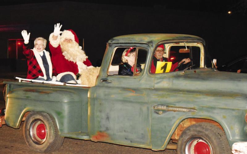 MR. &amp;amp; MRS. CLAUS - Santa and Mrs. Claus waved to the crowd during the parade portion of the Fesitval of Lights. After making their way downtown, Santa spent the evening taking photos and talking to children and families. (Photo Courtesy of Delany Jackson)