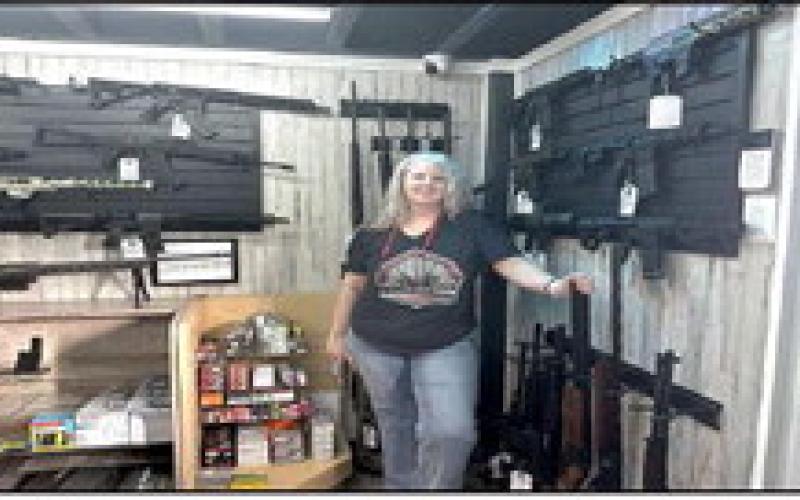 GUNS UP - Kori McNeal is welcoming new and veteran gun enthusiasts to come through her doors and check out her wide range of fire arms. (Staff photo by Hannah Woodrum)