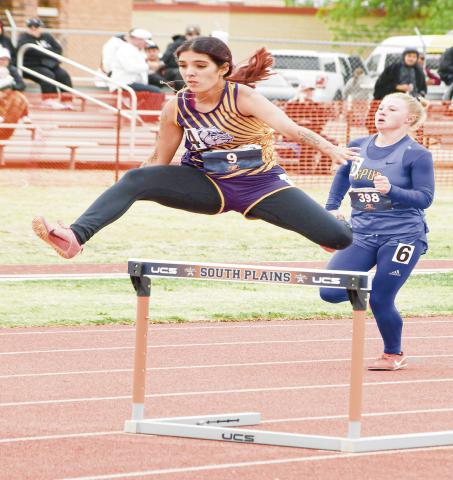 MANCIAS HURDLES - Anton Lady Dawg Alyssa Mancias clears a hurdle during her 300-meter hurdles race this past Friday at the Regional Championships at South Plains College. (Staff photo by Jentezen Smith)
