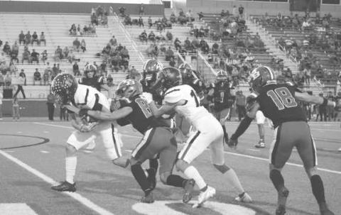 STRONG RUN - Levelland running back Jake Potter ran the ball well against the Borger defense dragging multiple defenders on his way. (Staff photo by Aalijah Soliz)