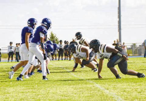 LINE OF SCRIMMAGE – Smyer and Morton line up for a play against each other during their football scrimmage this past Thursday at Bobcat Stadium. (Photo by Jentezen Smith).
