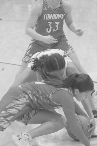 HUSTLE PLAY- The Sundown Roughettes traveled to Tahoka Friday night and handed the Lady Bulldogs a 56-41 loss in district play. Natalie Urias dove on the ground after a loose ball during the contest. The Roughettes traveled to Plains to take on a 20-5 Cowgirls squad Friday. (Photo Courtesy Chris Bratcher)