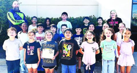PREMIER MARTIALARTS FIELD TRIP-- LISD Capitol Elementary second and third graders and PE teacher Kristy Sanders recently took a karate field trip to Premier Martial Arts in Lubbock. Students learned about being kind, confident, and disciplined as well as learning a few basic self-defense and karate moves. (Photo courtesy of Kristy Sanders)