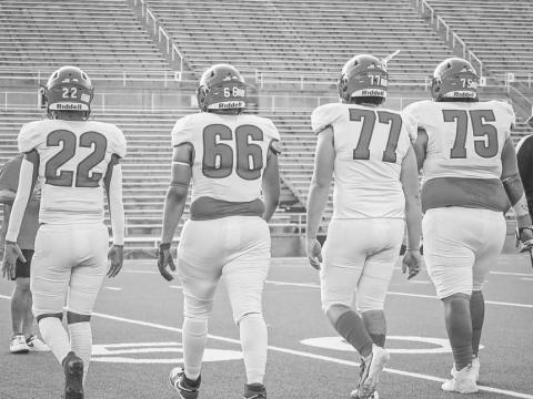TEAM CAPTAINS - Sundown Roughnecks Isaac Lopez, Zack Gonzales, Hunter Clark and Jesus Rodriguez walked to the center of the field for the coin toss last Thursday in Canyon for the team’s season opener against the Shamrock Fighting Irish. (Staff photo by Aalijah Soliz)