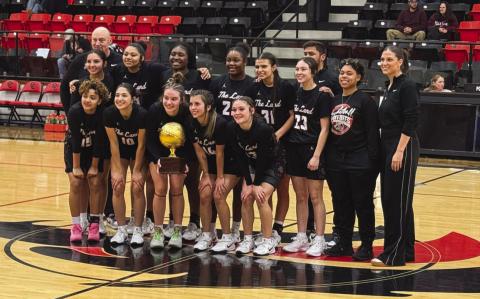 BI-DISTRICT CHAMPIONS - The Levelland Loboettes won over the Brownwood Lady Lions this past Monday night in Colorado City to win the Bi-District round of playoffs. Pictured above are Coach Clay Barnett with his team in Colorado City. (Staff photo by Aalijah Soliz)