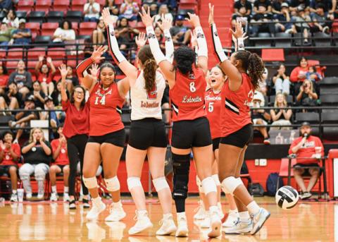 HANDS UP CELEBRATION – The Levelland Loboettes and their Head Coach Jai Madrid celebrate their set win in a match against SA Lakeview this past Tuesday. The Loboettes would go on to sweep them 25-19, 30-28 and 26-24.