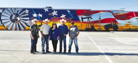 MURAL FOR THE COMMUNITY - The parking lot project was recently completed with Muralist Alfonso Garcia of Tulia completing his mural on the wall facing the lot. The parking lot is located across the Hockley County Annex at the corner of Austin Street and Avenue H. Pictured from left to right are: Commissioner Tommy Clevenger, Commissioner Alan Wisdom, Hockley County Judge Sharla Baldridge, Commissioner Larry Carter and Commissioner Seth Graf. (Photo courtesy of Kelli Martin)