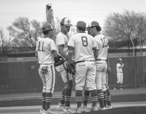 GROUP UP - Sundown Roughnecks gathered around the mound during the team’s game against the Tahoka Bulldogs last Saturday morning at home. (Staff photo by Aalijah Soliz)