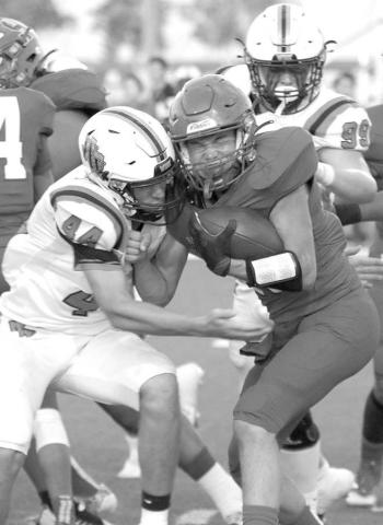 METATTHELINE- Sundown Roughneck Hunter Tindol is met at the line of scrimmage by a Wink defender. The Roughnecks hosted the Wink Wildcats for homecoming and fell, 56-14. Sundown will travel to Roosevelt to play a tough Eagle squad on Friday, September 23rd. (Photo Courtesy of Chris Bratcher)