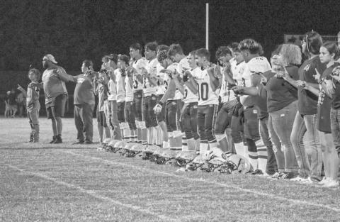 SCHOOLSONG - The Anton Bulldogs lined up for their school song after their win against the Chillicothe Eagles this past Thursday in Motley County. (Staff photo by Aalijah Soliz)