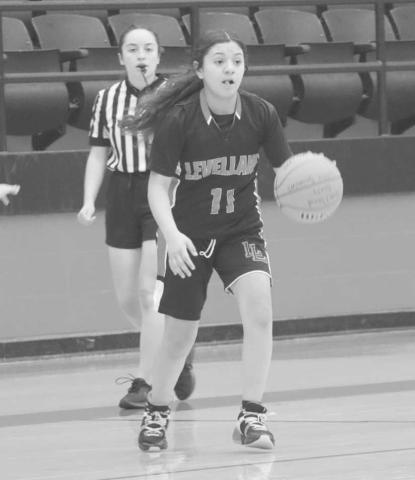READY TO PASS - Levelland Loboette Ariana Sanchez pushed the ball down the court to get it to her teammates during the team’s game against Hardin Jefferson this past Wednesday at LHS. (Staff photo)
