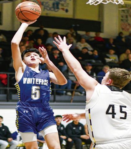 GANDARA GOIN’ UP - Whiteface’s Ivaniel Gandara goes up with a floater while Morton’s Britton Boggs guards him during their basketball game at Morton High School this past Tuesday. (Staff photo by Jentezen Smith)