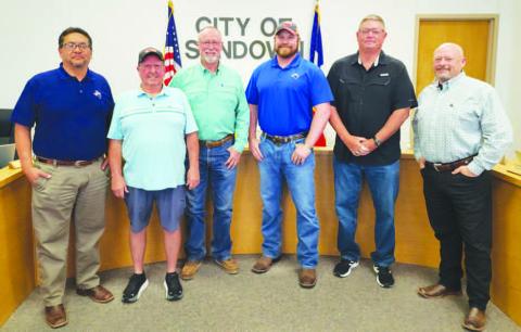 OPPORTUNITY FOR GROWTH - The City of Sundown announced the acquisition of several properties from Sabinal Energy through donation during their March City Council meeting. Pictured from left to right are: City Administrator Billy Hernandez, Alderman Doug Barry, Sabinal North District Operations Superintendent Craig Blair, Mayor Jonathan Strickland, Alderman Ron Holson, Alderman Dr. Brett Fryar, Alderman not pictured were Dennis Heatherly and Lonnie Geisler. (Staff photo by Dom Puente)