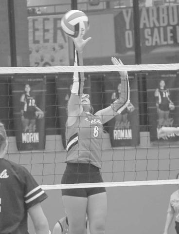 SOFT TOUCH - Levelland Loboette Hailiee Estrada tapped the ball over the net to throw the Cowgirls defense off during their last matchup this past Tuesday at home. (Staff photo by Aalijah Soliz)