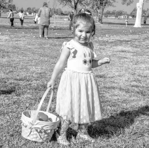 EGG-SPECTING A GREAT EASTER - Amaya Rincones was all smiles while trotting down the bunny trail looking for Easter eggs this past Saturday at the City Park. (Staff photo by Hannah Woodrum)