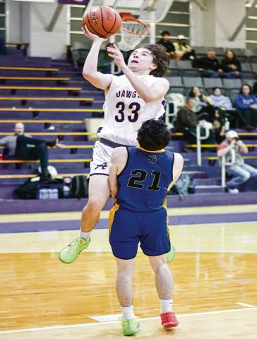 CARLOCK PUTS IT UP - Anton Bulldog Caleb Carlock puts up a shot during their game against Wellman Union this past Friday night at Anton High School. (Staff photo by Jentezen Smith)