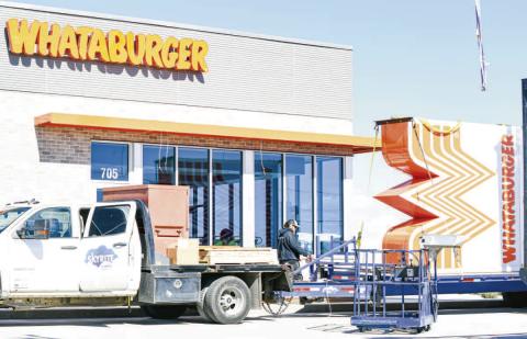 ALMOST COMPLETE— The final stages of the Whataburger restaurant are nearing completion with the addition of signage. Construction crews have been working on the restaurant since summer of 2025. The restaurant is located at 705 Hwy 114 and is expected to be open this month. (Staff photo by Jentezen Smith)