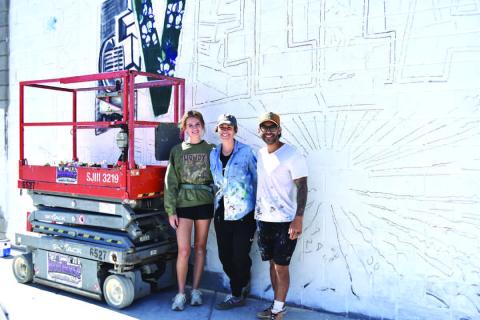 MURALARTIST-- Artists Lexi Antonick, Calina Mishay and Daniel Andreu completed the new mural near downtown this past weekend bringing their talent and color to the City of Mosaics. Located at the corner of Ave. F and Houston St. the vibrant new mural depicting the city and region came to life this past week just as the Centennial Celebration is about to gear up. (Staff photo)