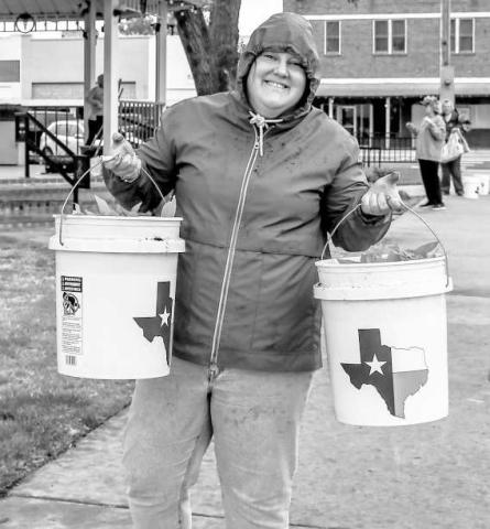 PLANT HAPPINESS - Jolenna Carter was all smiles helping plant flowers in downtown Levelland for Main Streets Community Planting Day this past Saturday. (Staff photo by Hannah Woodrum)