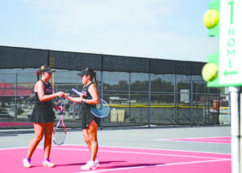 DAP IT UP – Teagan Brothers and Madison Almager dap it up after scoring a point in their double's matchup against Big Spring at the Levelland Tennis Courts on August 2. (Staff photo by Jentezen Smith)