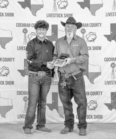 SENIOR RESERVE LAMB SHOWMAN - Noah Jamie received a buckle donated and presented Billy and Sandy Roberts for winning Senior Reserve Lamb Showman at the Cochran County Livestock Show and Sale. (Staff Photo By Essence Childers)