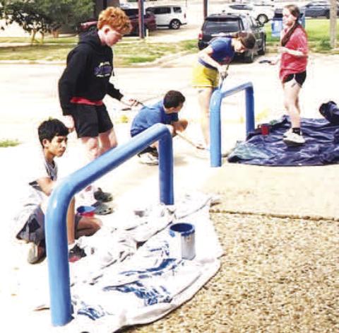 COMMUNITY PROJECT - Sundown XC runners took the morning off from workouts for a community project to repaint the hand railings and parking stops at City Hall as well as the water refill station. (Sundown ISD photo)