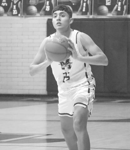 CHEST PASS - Morton Indian E.J. Rivas passed the ball to his teammate up the court in their contest against the Lubbock Titans this past Tuesday at home. (Staff photo by Aalijah Soliz)
