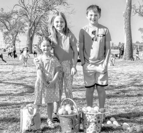 HUNTING FOR EGGS - The City of Levelland’s’ Parks Department hosted their annual Easter Egg Hunt this past Saturday at the City Park near Pavillion One. Pictured from left to right are: Brinleigh Durham, Jacelyn Madewell and Jarrett Madewell. (Staff photo by Hannah Woodrum)