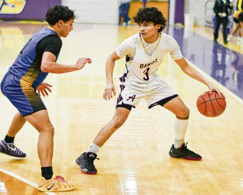 CAMPOS ON THE DRIBBLE - Anton Bulldog Shooter Campos dribbles the basketball during a game against Wellman Union this past Friday night at Anton High School. (Staff photo by Jentezen Smith)