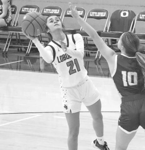 FADEAWAY - Levelland Loboette Carly Tienda shot the ball during the teams first game of the Littlefield Tournament against the Olton Phillies where they girls won 69-20. (Staff photo by Aalijah Soliz)