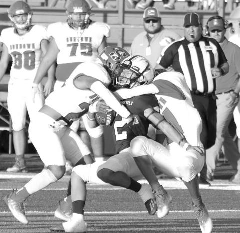 COMBO TACKLE- The Sundown Roughnecks traveled to Acuff to face the 3A Roosevelt Eagles on Friday night and left with a three point loss 26-29. Adan Escamilla and Riccky Melendez combine for a defensive stop. The Roughnecks have a bye this week and will return to the field for their district opener in Floydada October 7.(Photo Courtesy of Chris Bratcher)