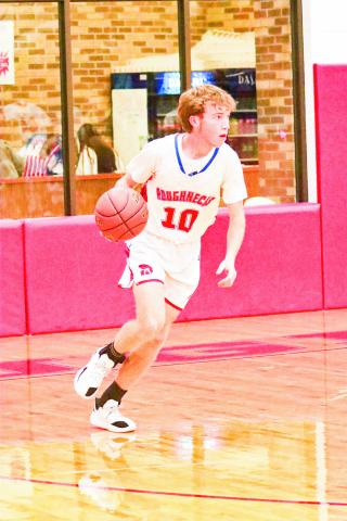 IGO BRINGS IT UP - Sundown Roughneck Isaiah Igo dribbles the basketball up the court during a home game earlier this month. Igo scored five points in the win against Sudan. (Photo provided by Sundown ISD)