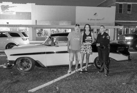 CRUISE WINNER - Pictured is Cody and J’Lyn Poage with LPD Chief Erica O’Bryon after receiving an award during the Thunder on the Plains Cruise. (Photo courtesy of J. Conrad Photography)